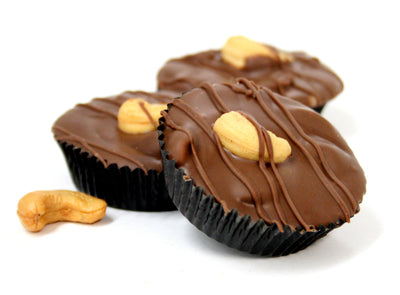 Hand Dipped Milk Chocolate Cashew Clusters. Net Wt. 1.00 lb.