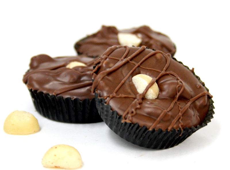 Hand Dipped Milk Chocolate Macadamia Nut Cluster. Net Wt. 1.00 lb.